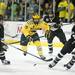 Michigan junior right wingman Derek DeBlois skates after the puck in the third period of the game against Western Michigan on Saturday. Daniel Brenner I AnnArbor.com